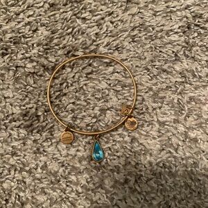 Gold with blue water drop Alex and ani bracelet